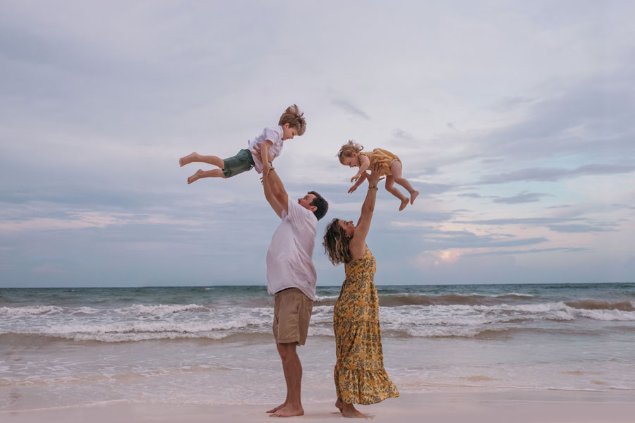 candid family beach photographer in Tulum, Mexico